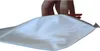 A hand is holding a red clip to seal a white bag. Náhled obrázku produktu