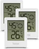 Three white digital thermometers/hygrometers are shown, with one in the foreground and two slightly behind and to the sides. Anteprima dell’immagine prodotto