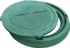 A green manhole cover and its frame are shown on a white background. Produktbild-Vorschau