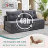 A gray sofa bed is shown in a living room setting with a plant in the background. Overlay graphics indicate features. Náhled obrázku produktu