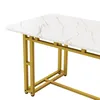 A close-up view of a modern dining table with a marble-patterned top and golden metal legs, set against a white background. Podgląd zdjęcia produktu