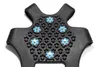A close-up, top-down view of a black shoe spike accessory with blue and silver studs. Produktbild-Vorschau