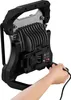 A hand is shown plugging a cable into the back of a portable LED work light. Produktbild-Vorschau