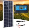 A solar panel kit is displayed outdoors with a scenic background of hills and a sunset. Produktbild-Vorschau