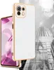 A white and gold phone case is shown in front of a black and white image of a skyscraper. Produktbild-Vorschau