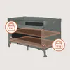 A grey travel crib with two highlighted mattress levels and weight indicators. Voir les images du produit