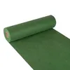 A roll of green fabric or paper is shown, unrolling diagonally across a white background. Produktbild-Vorschau