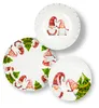 Three plates with a Christmas gnome theme are arranged on a white background. Anteprima dell’immagine prodotto
