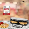 A Clatronic waffle maker with waffles and strawberries on a table. Náhľad obrázku produktu