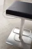 A close-up of a modern bar stool with a black seat and a brushed stainless steel base and column. Produktbild-Vorschau