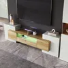A modern TV stand with LED lighting, displaying electronic devices and decorative items. Náhľad obrázku produktu