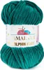 A ball of teal yarn with a label. Produktbild-Vorschau