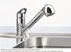 A chrome kitchen faucet with a pull-out spray head is shown installed in a stainless steel sink. Anteprima dell’immagine prodotto