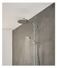 A modern bathroom shower with two shower heads, one in use. Produktbild-Vorschau