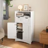 A white storage cabinet with two doors and two drawers, shown in a room setting with a window and a side table. Produktbild-Vorschau