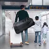 A family walking through an airport or train station with luggage. Náhľad obrázku produktu