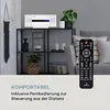 A compact stereo system is displayed on a shelf in a living room setting, with a remote control in the foreground. Produktbild-Vorschau