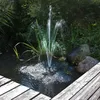 A solar-powered fountain in a pond with surrounding greenery and a wooden deck. Produktbild-Vorschau