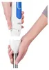 Hands assembling a white and blue immersion blender. Produktbild-Vorschau