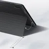 A black tablet case is shown propped up in a standing position, demonstrating its functionality. A dotted line with arrows indicates the adjustable angle of the stand. Produktbild-Vorschau