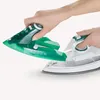 Hands assembling a green and white steam iron. Produktbild-Vorschau