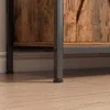 A close-up view of the bottom section of a wooden cabinet with metal legs. Náhľad obrázku produktu