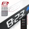 A close-up marketing image of a digital alarm clock, showcasing its LED display and touch controls. Náhled obrázku produktu