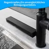 A close-up view of a black kitchen faucet with a waterfall-like water stream flowing over a brush attachment. Produktbild-Vorschau