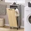 A laundry room scene with a washing machine, laundry hamper, and trash can. Produktbild-Vorschau