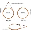 Three views of a round mirror with a wooden frame and a leather hanging strap. Produktbild-Vorschau