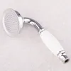 A close-up studio shot of a shower head with a white ceramic handle. Podgląd zdjęcia produktu