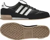 A black Adidas Mundial Goal soccer shoe and its sole are shown from the side and underneath. Náhled obrázku produktu