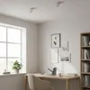 A well-lit room with a desk, chair, window, and bookshelf, suggesting a home office or study area. Náhľad obrázku produktu