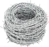 A roll of barbed wire is shown against a white background. Voir les images du produit