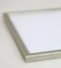A close-up, angled view of a silver picture frame with a white insert. Produktbild-Vorschau