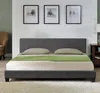 A bedroom scene with a bed, pillows, and a green throw. Produktbild-Vorschau