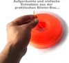 A hand holding a piece of orange trimmer line, with a spool of the same line in a clear plastic box in the background. Produktbild-Vorschau