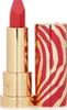 A red lipstick with a gold, zebra-striped case is shown against a white background. Anteprima dell’immagine prodotto
