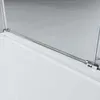Close-up of a shower enclosure's metal frame and glass edge. Produktbild-Vorschau