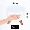 A white bowl-shaped planter with wooden legs, shown with a hand for scale, and dimensions indicated. Náhled obrázku produktu