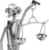 A close-up of a metal figurine of Justitia, the Roman goddess of justice, holding scales. Náhľad obrázku produktu