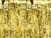 A close-up, full-frame shot of a gold tinsel curtain, likely used as a party decoration or backdrop. Produktbild-Vorschau