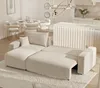 A modern living room with a sectional sofa, dining table, and kitchen island. Voir les images du produit