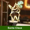 A close-up of a Santa Claus-shaped LED light decoration hanging in front of a blurred background. Produktbild-Vorschau