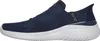 Side view of a navy blue Skechers slip-on sneaker with a white sole. Náhľad obrázku produktu
