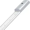 A close-up, angled view of an LED under-cabinet light strip with a silver aluminum housing and a white diffuser covering the LEDs. Produktbild-Vorschau