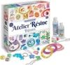 A product shot of a jewelry making kit with various components and the packaging box. Voir les images du produit