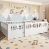 A nursery room with a white wooden bed, decorated with a mountain mural and balloons. Anteprima dell’immagine prodotto