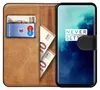 A book-style phone case with a phone inside, showing cards and money slots. Náhľad obrázku produktu