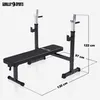 A black weight bench with silver uprights for holding a barbell, shown against a white background with dimensions indicated. Produktbild-Vorschau